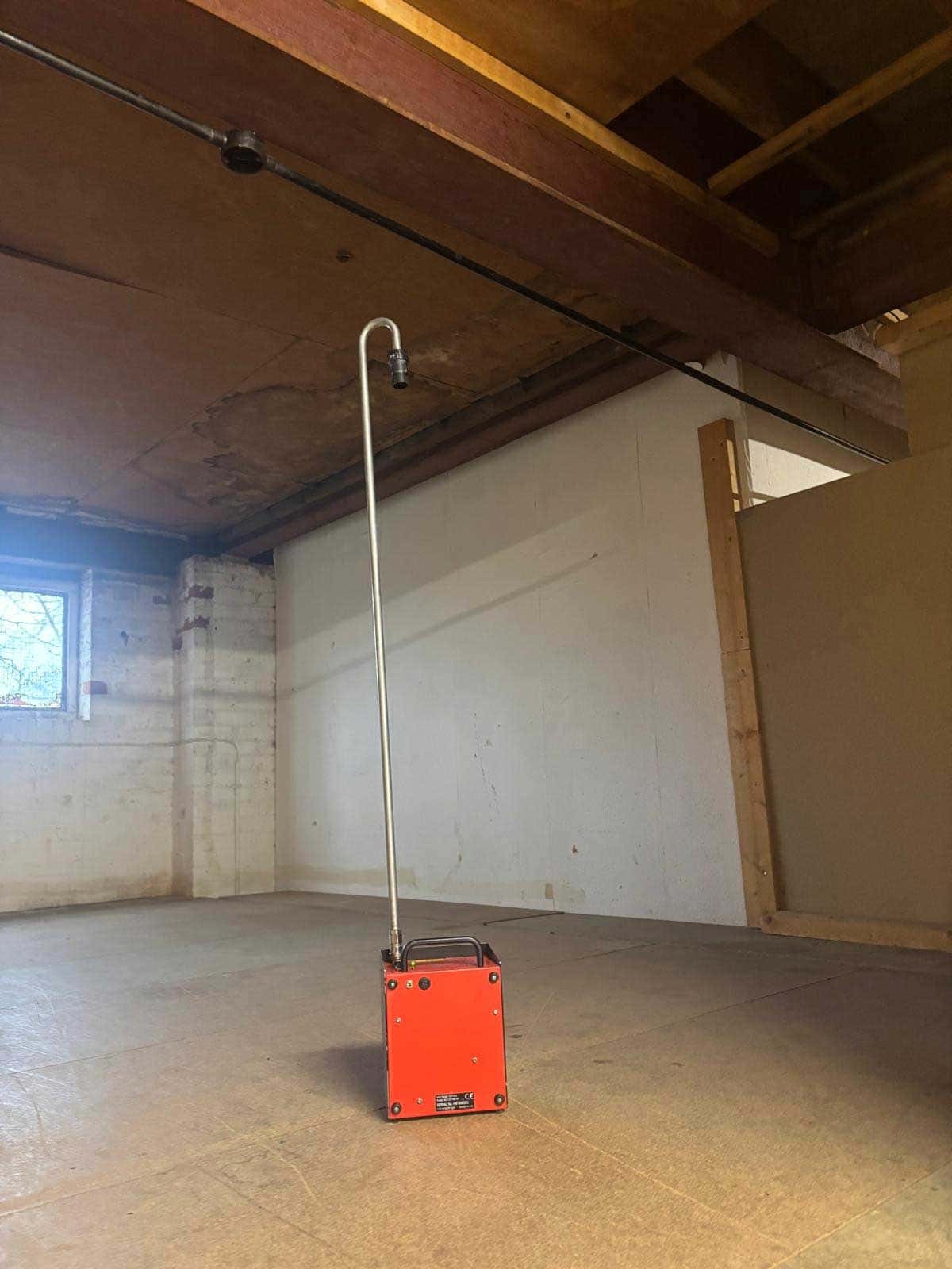 Air monitoring pump set up inside a stripped room