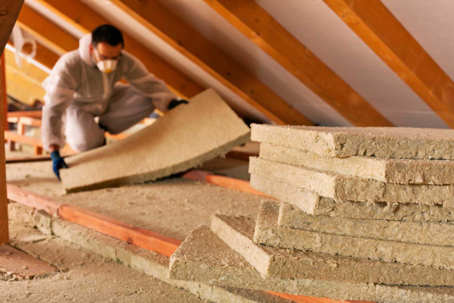 Mineral wool insulation batts stacked in a loft space